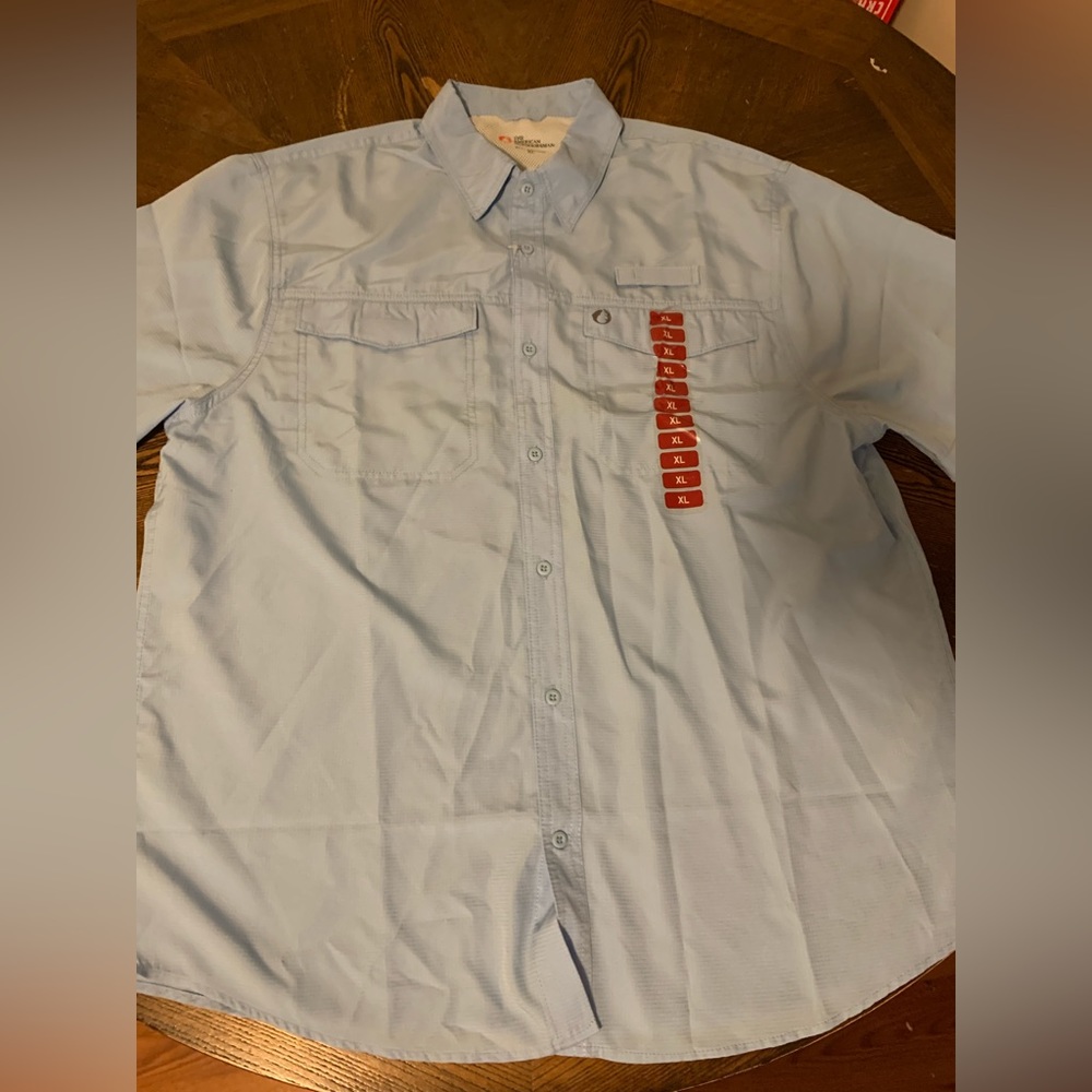 Men’s “The American Outdoorsman” shirt. Size XL in baby blue color.